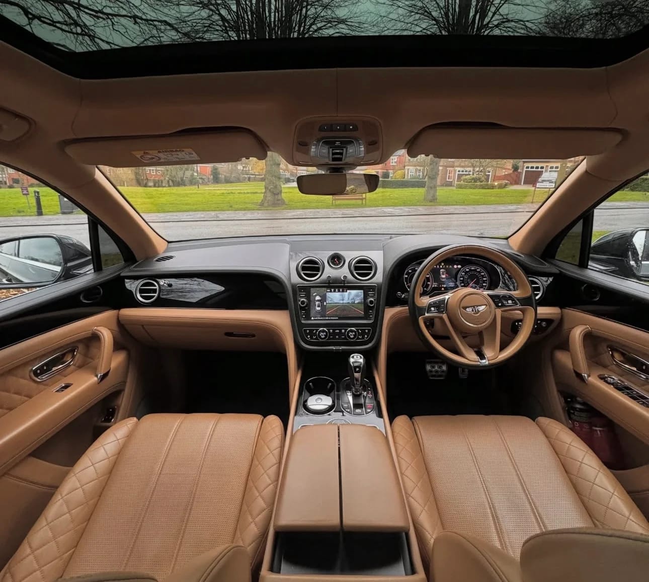 Bentley luxury saloon interior with tan quilted leather and premium dashboard