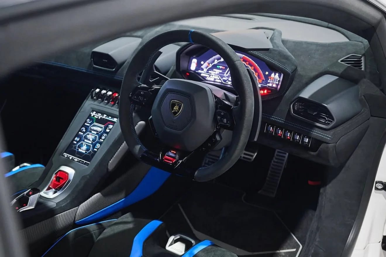 Lamborghini Huracán STO cockpit with blue Alcantara racing seats and carbon trim