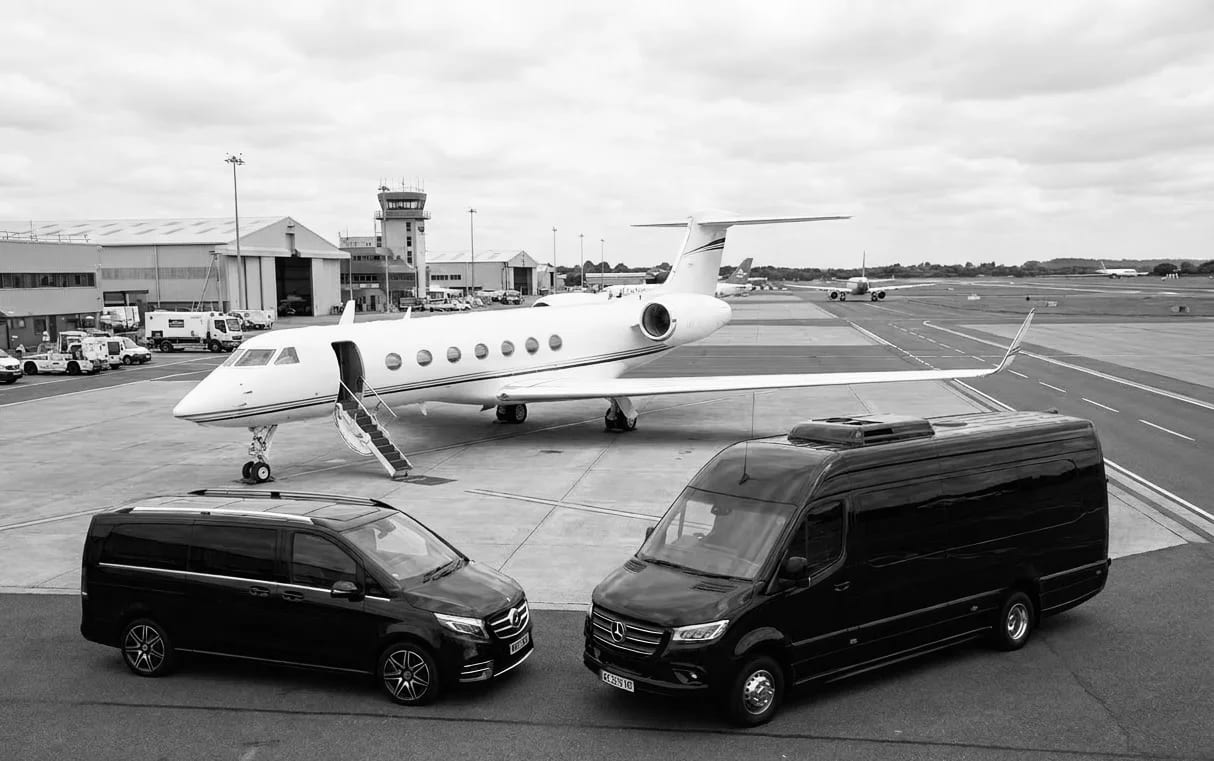 Executive chauffeur waiting for a business traveller at Heathrow Airport arrivals